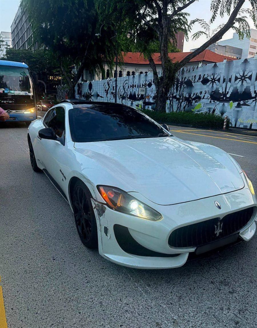 White Maserati coupe on a Singapore road